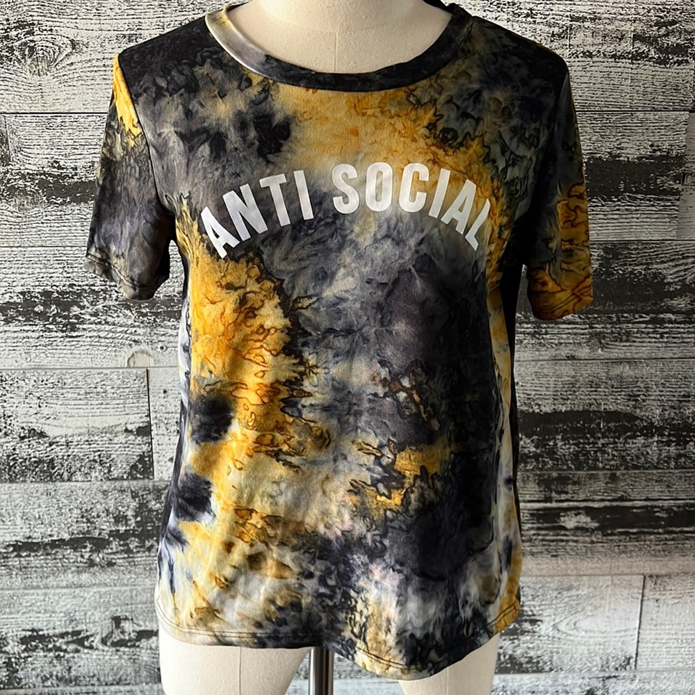 Black & yellow tie dye looking t-shirt with Anti Social across the chest.